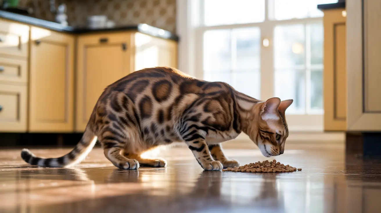 A Bengal cat eating kibble from a small pile on the kitchen floor